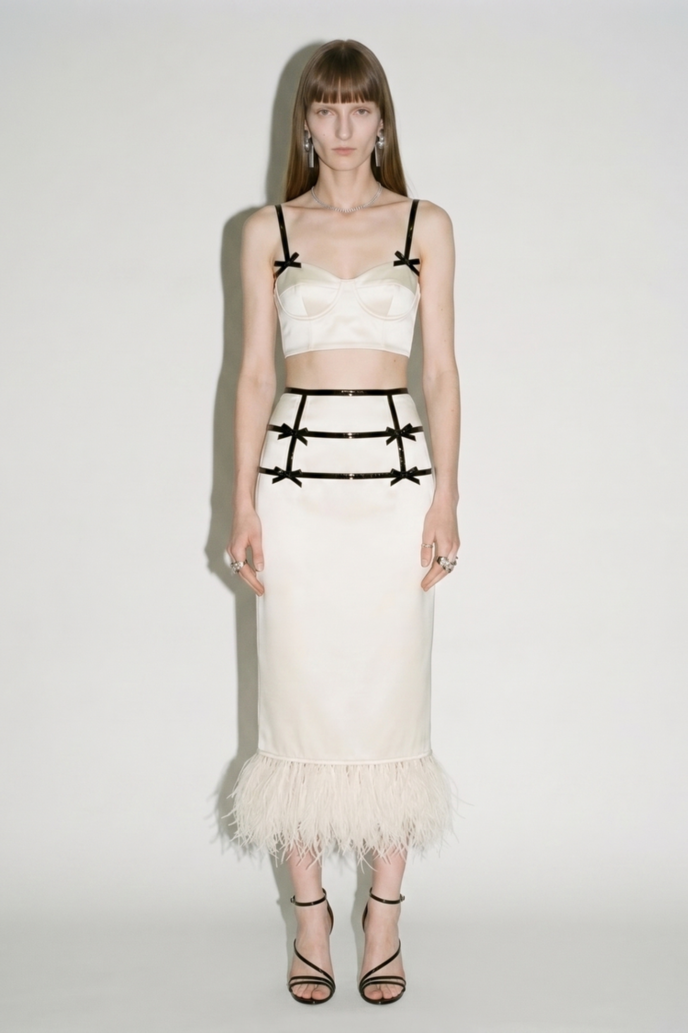 Ivory satin bow feather trim midi skirt styled on model