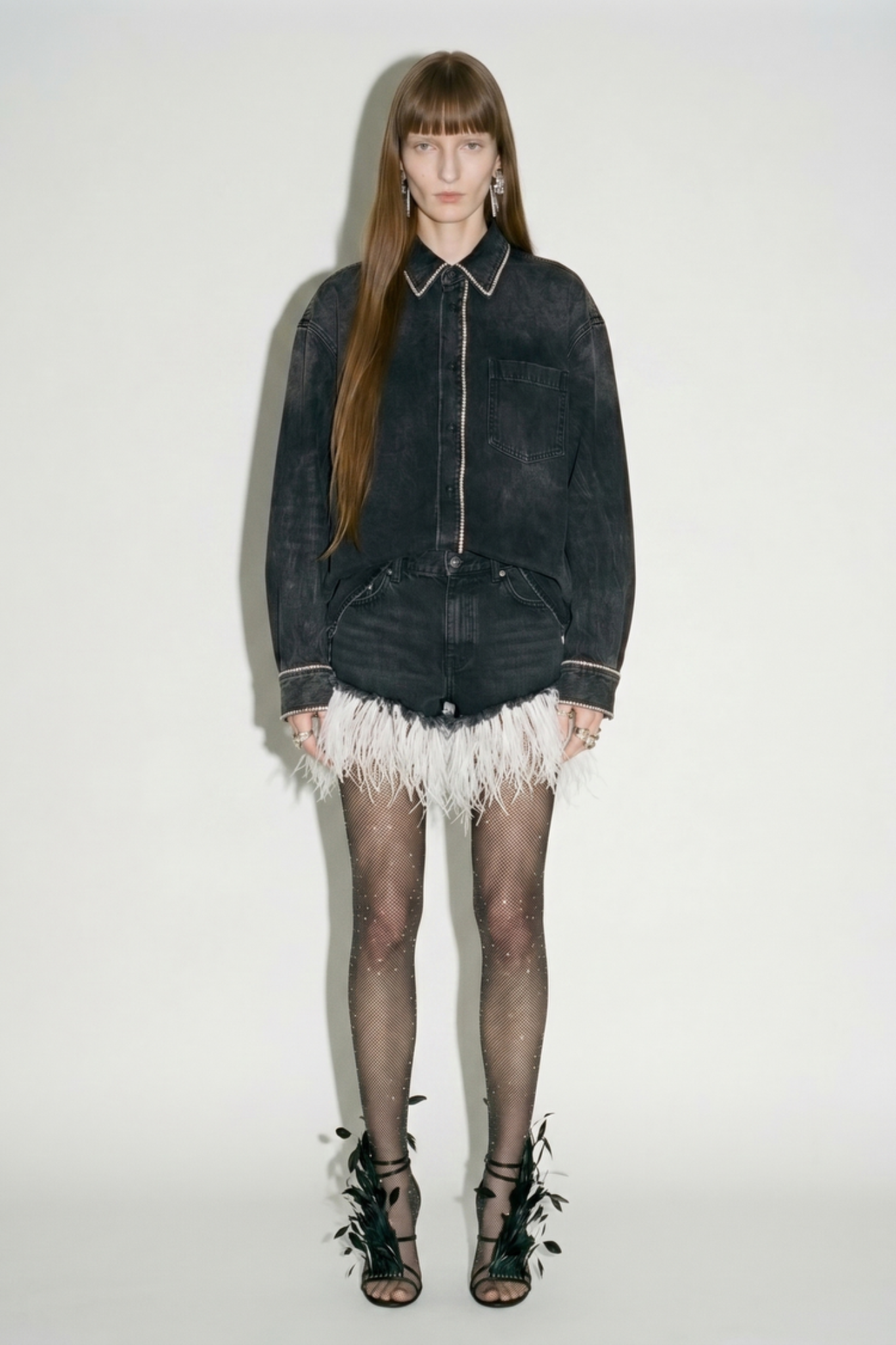 Black denim feather trim shorts styled on model