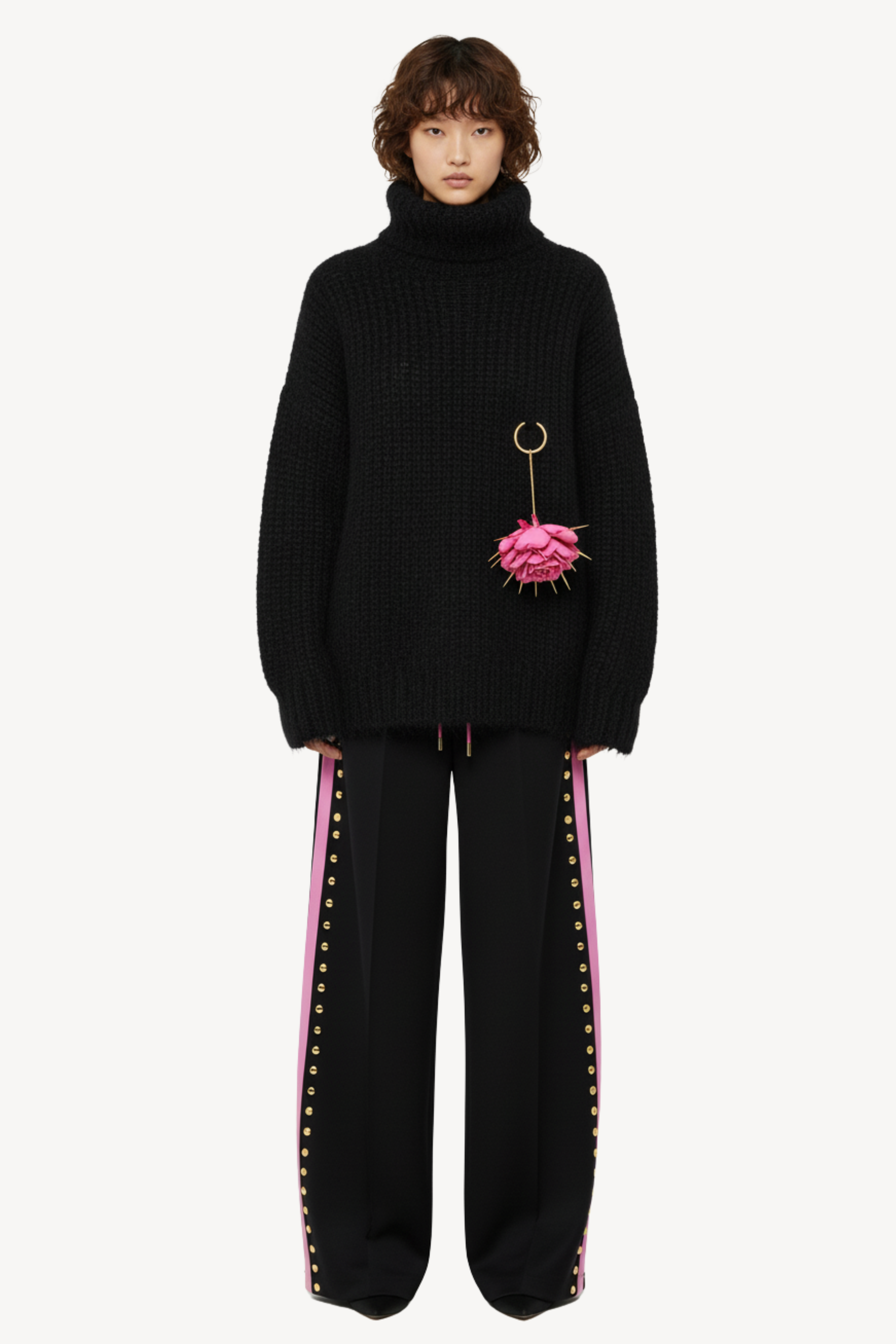 WOOL TURTLENECK SWEATER WITH FLORAL PENDANT IN BLACK